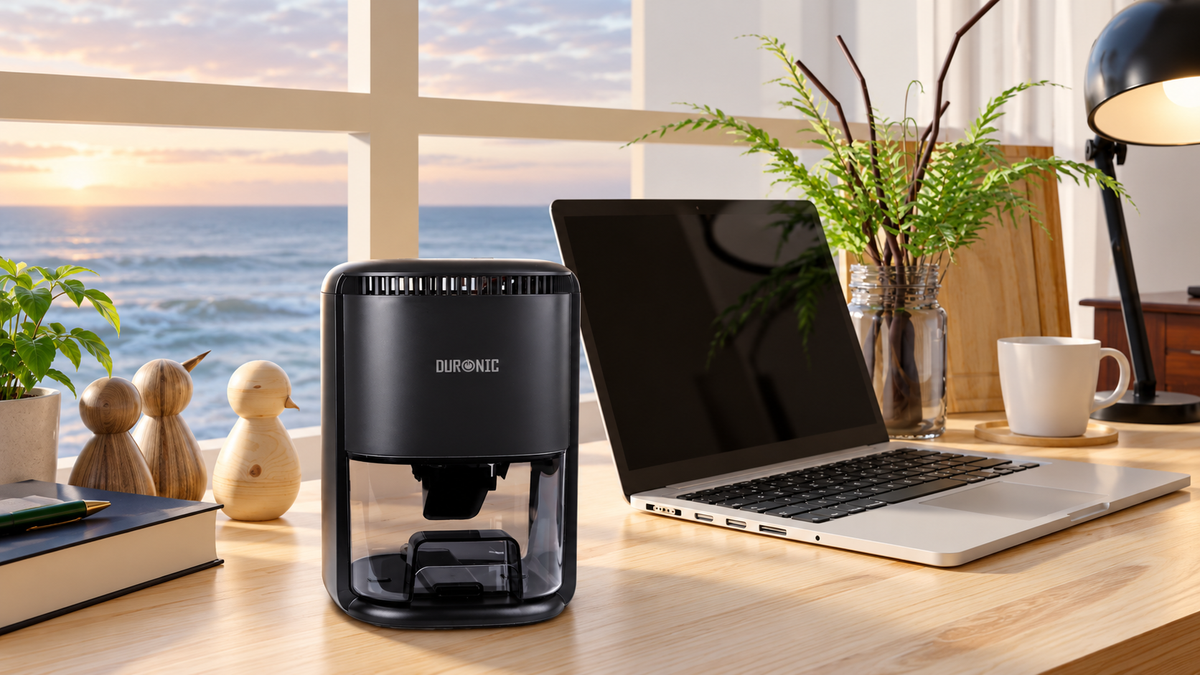 Duronic DH07 BK mini dehumidifier in use in an aesthetic desk setting