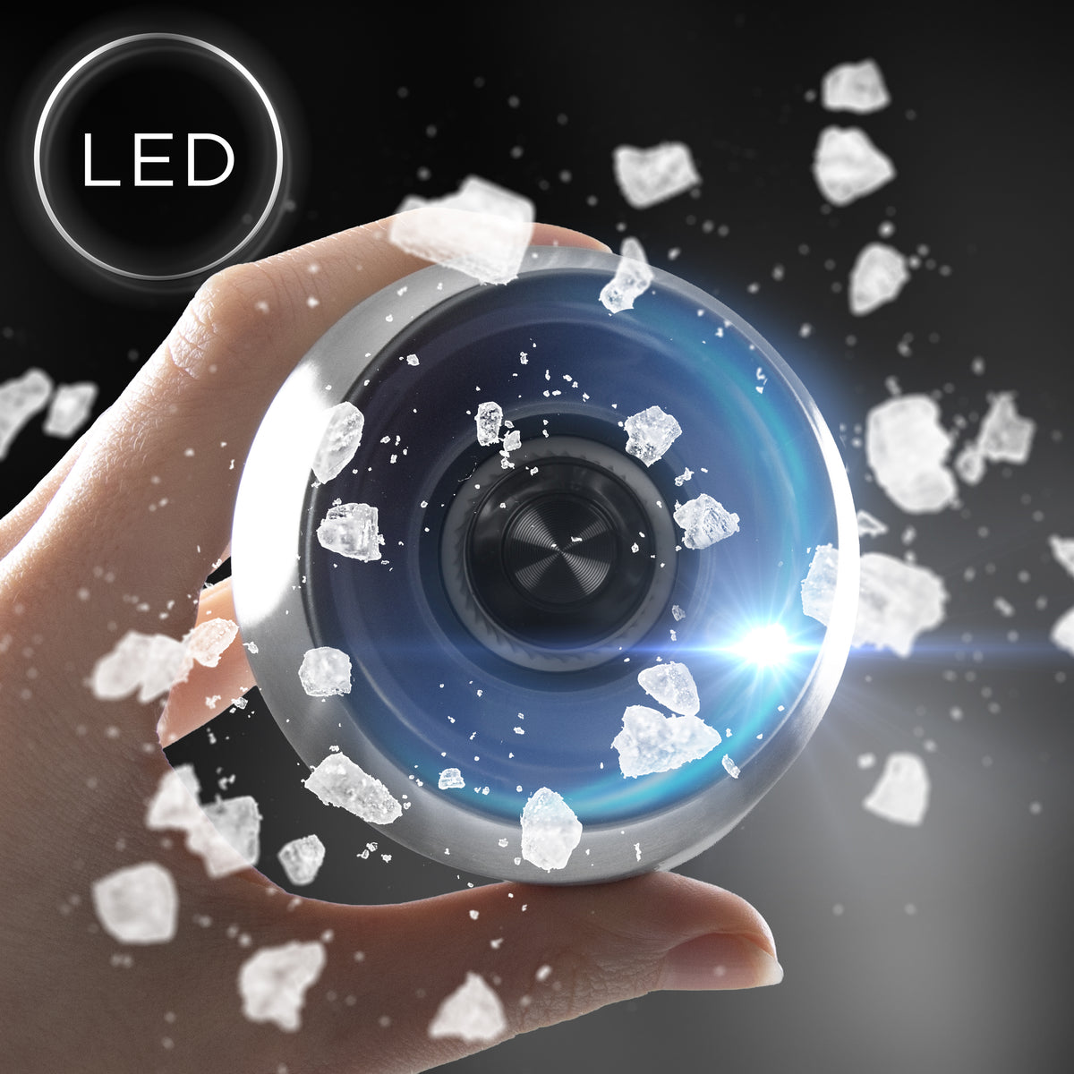 Duronic Electric Salt and Pepper Grinder Set surrounded by floating ice crystals on dark background.