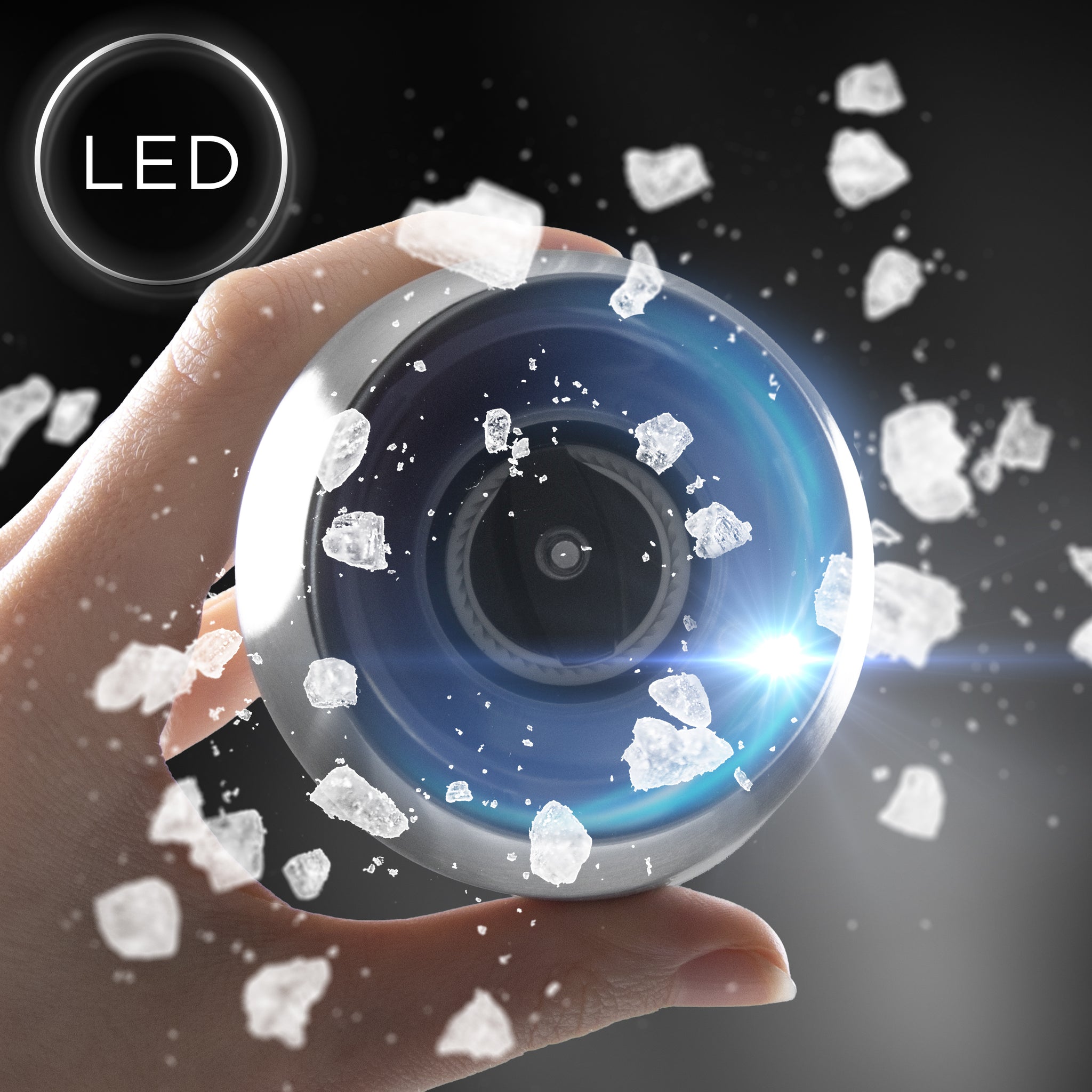 Duronic Electric Salt and Pepper Grinder Set with a bright LED light dispensing coarse salt crystals.