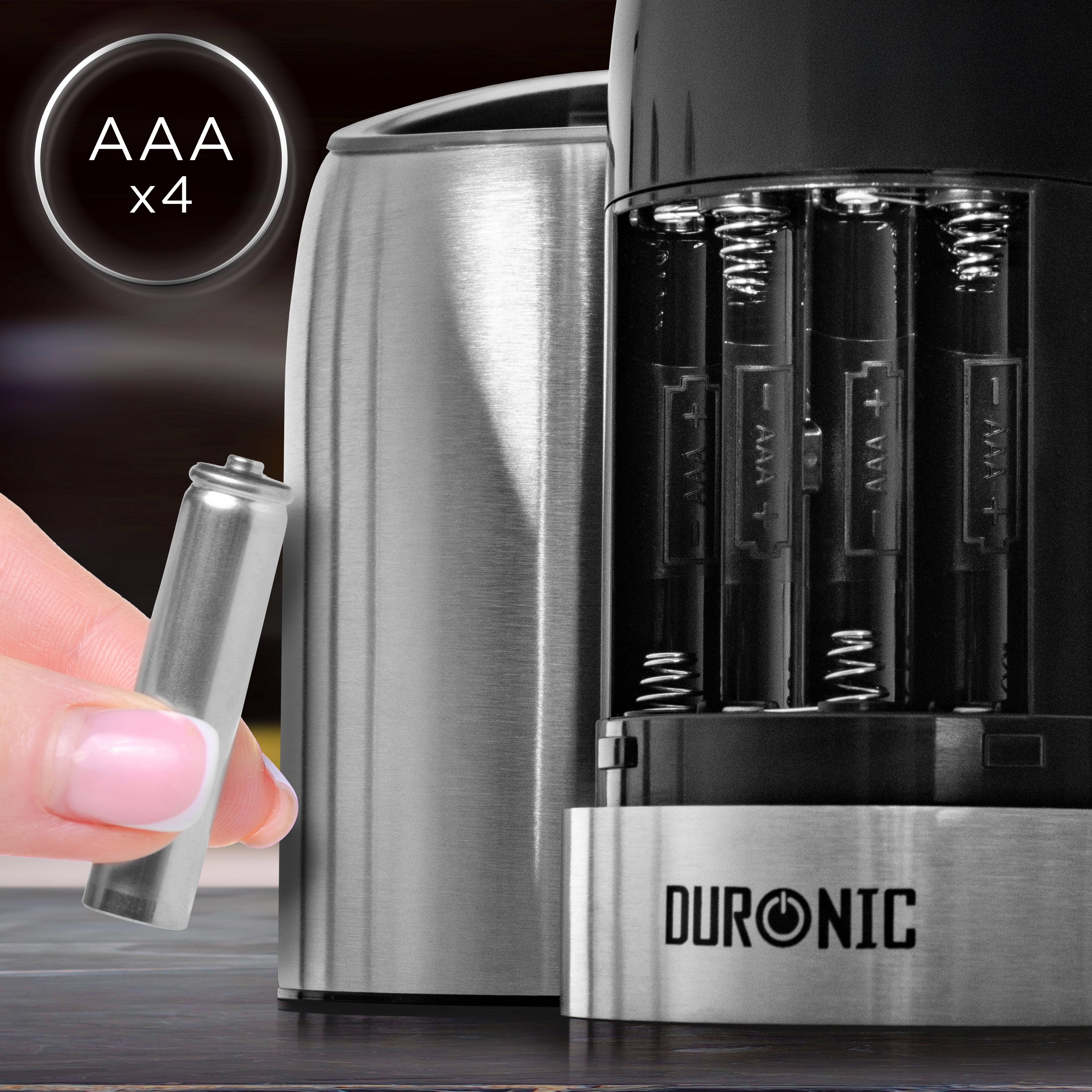 Duronic Electric Salt and Pepper Grinder Set with hand holding an AAA battery