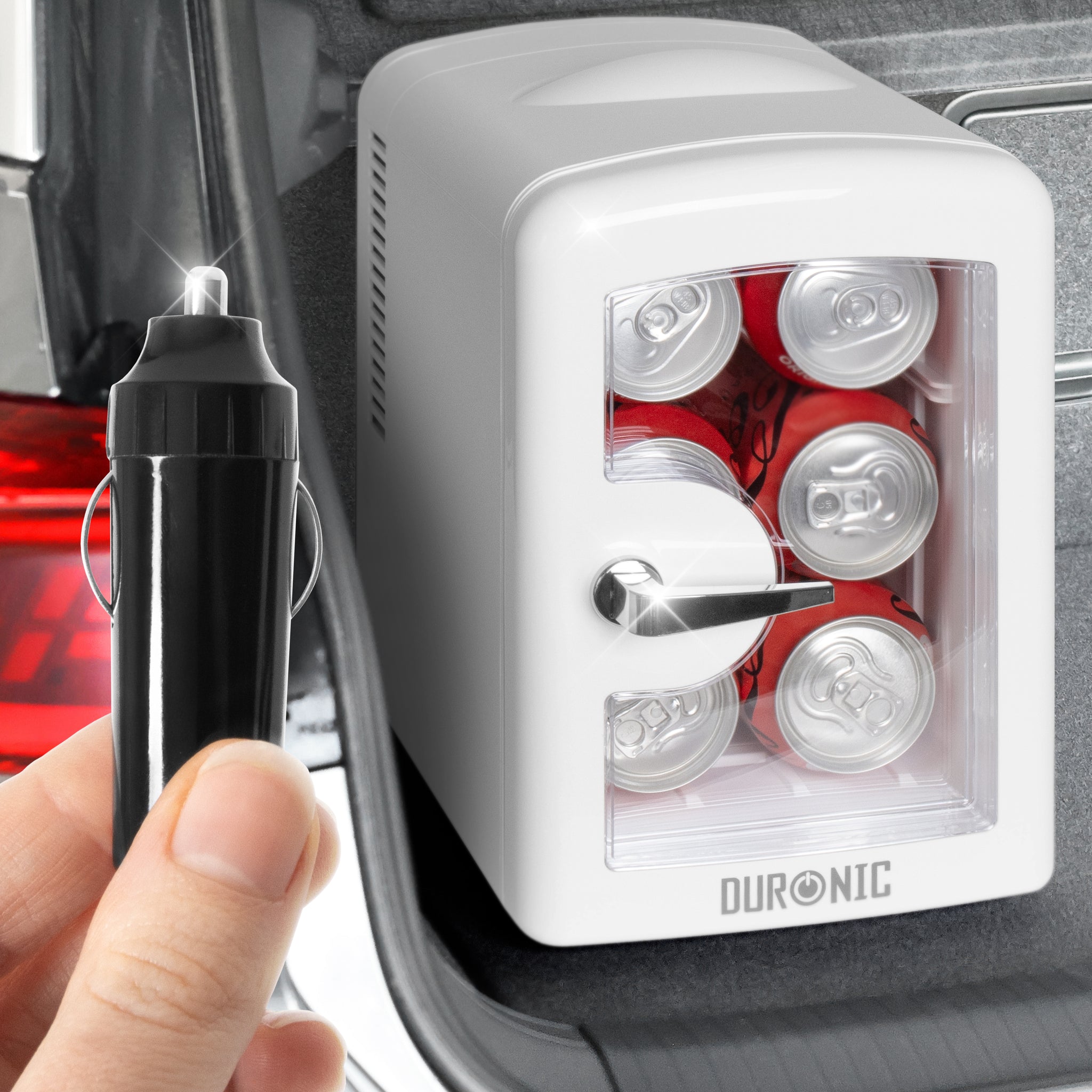 Duronic Mini Fridge Warmer holding soda cans in car trunk with 12V power plug.