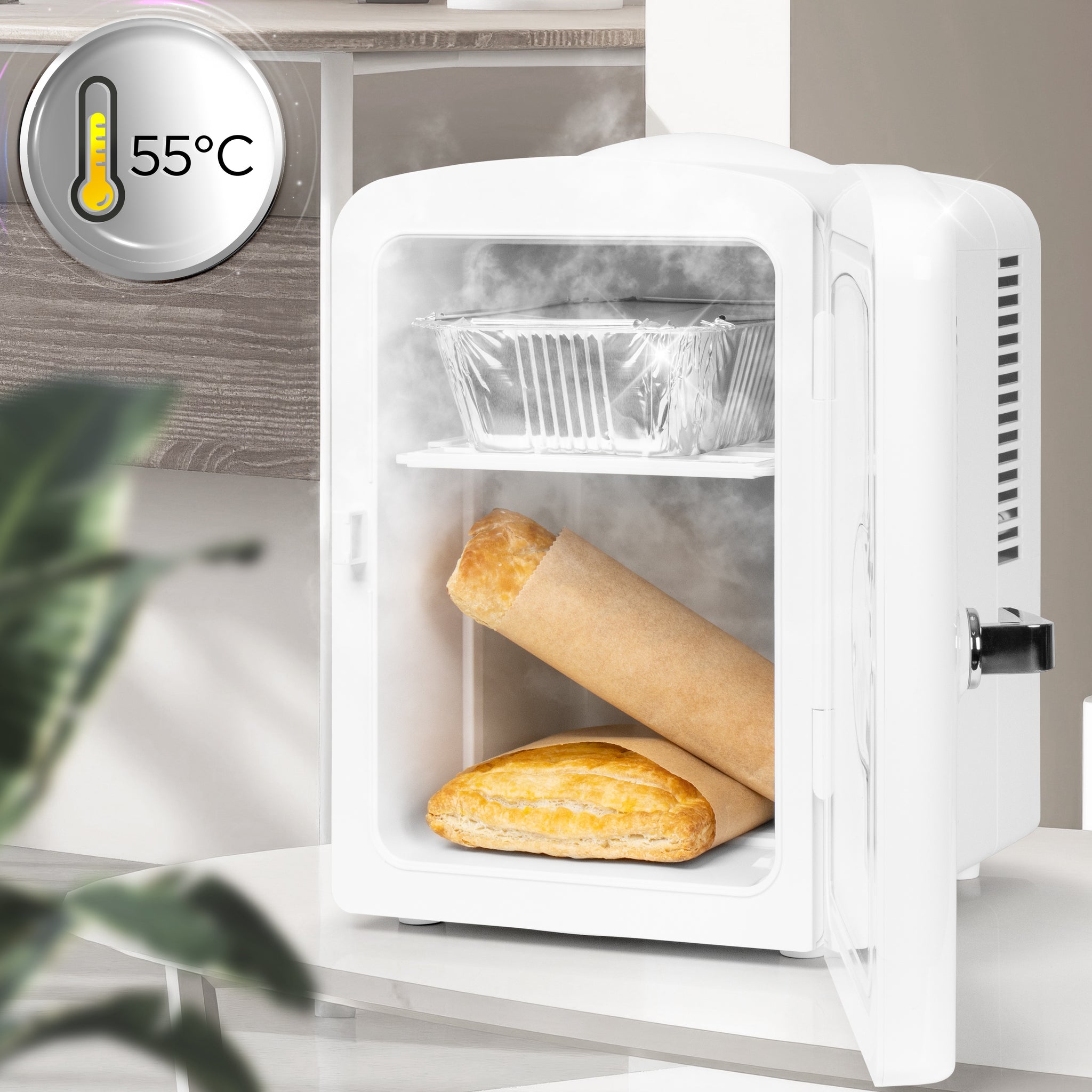 Duronic Mini Fridge Warmer warming baked food at 55°C with steam inside open door.