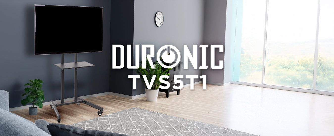 Duronic TVS5T1 ergonomic mobile tv stand shown in an aesthetically pleasing living room, holding up a tv