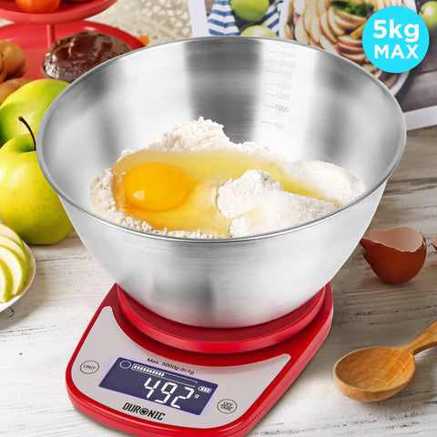 Duronic Digital Kitchen Scale weighing flour and an egg in a large stainless steel bowl.