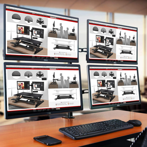 Duronic 80cm Pole displaying standing desk converters with a keyboard and mouse on a wooden table.
