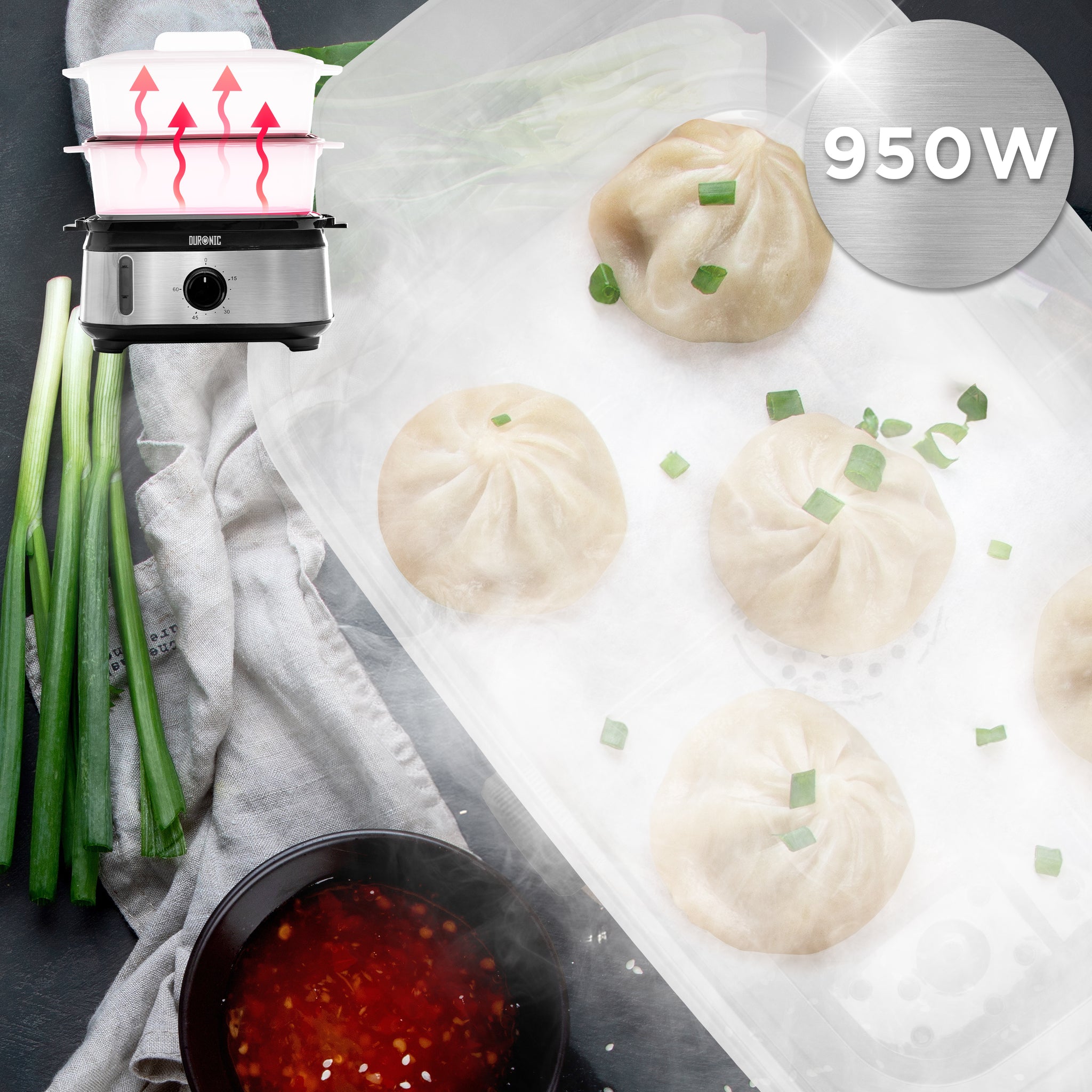 Duronic Black Electric Food Steamer with steaming hot dumplings, green onions, and dipping sauce.