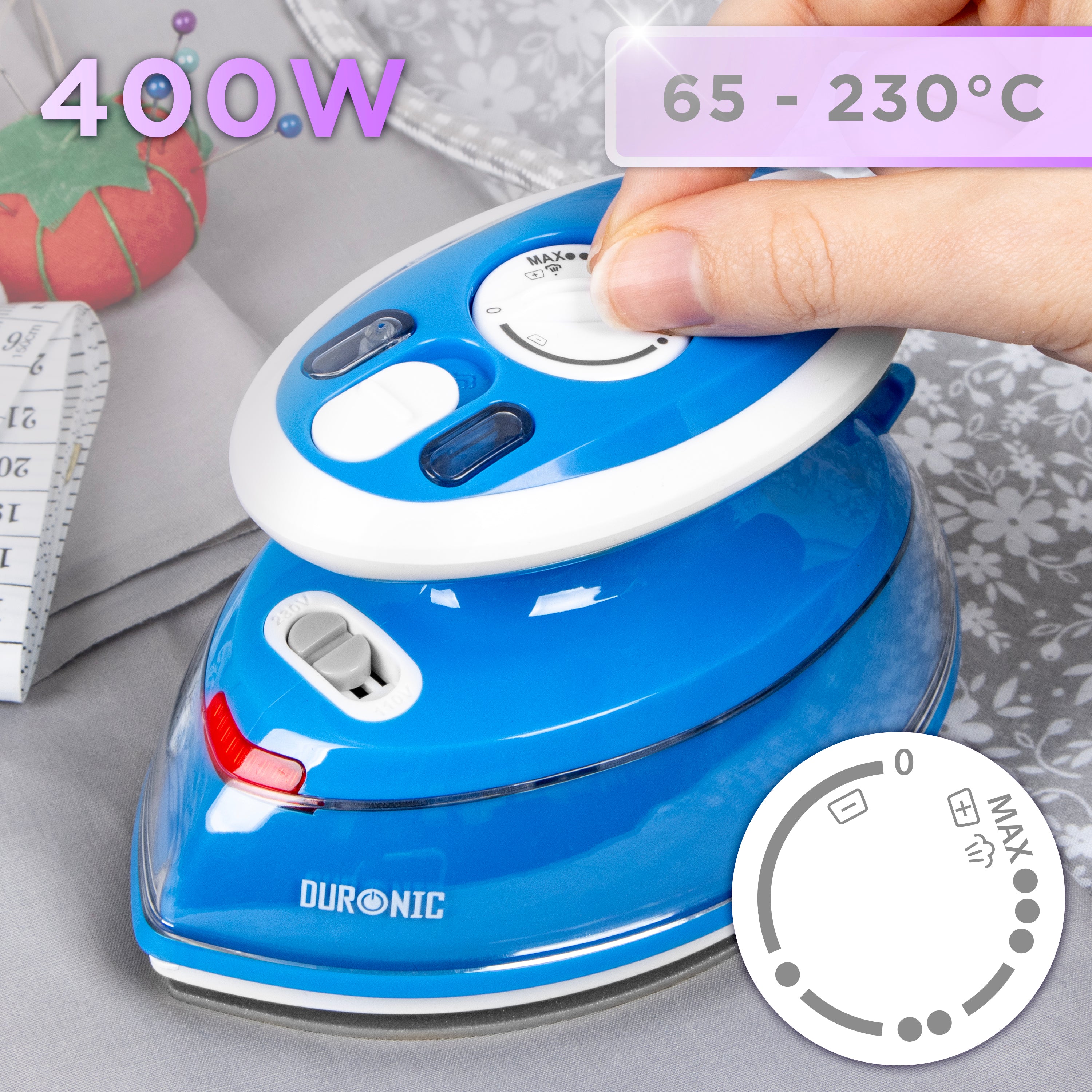 Duronic Blue Travel Iron with an adjustable temperature dial ranging from 65°C to 230°C, shown next to sewing supplies.