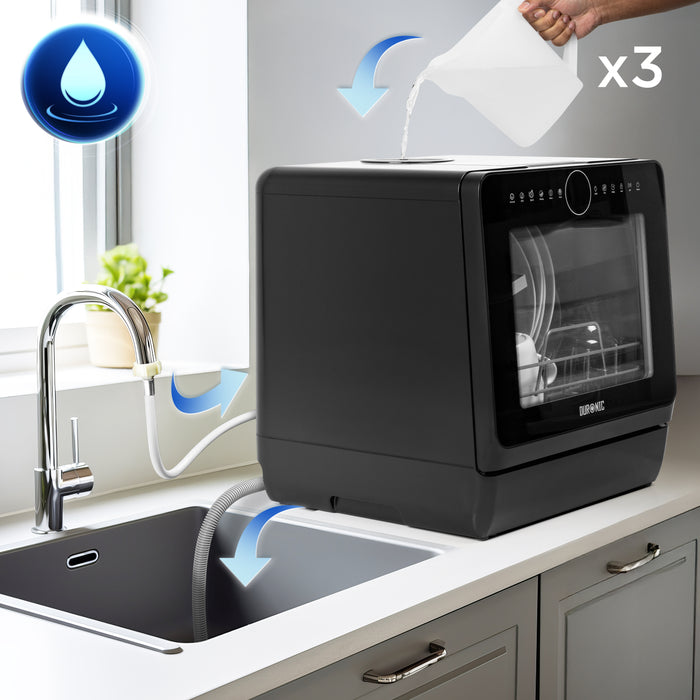 Duronic DW5 BK tabletop dishwasher pouring 3x jugs of water to clean plates cutlery glasses fruit