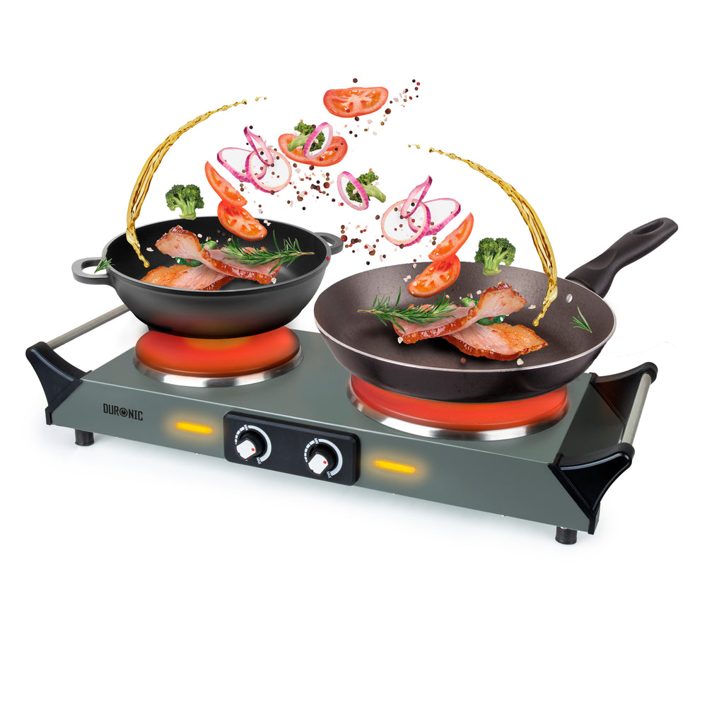 Duronic Electric Hot Plate HP2 GG with cooking pans, meat, and flying vegetables.