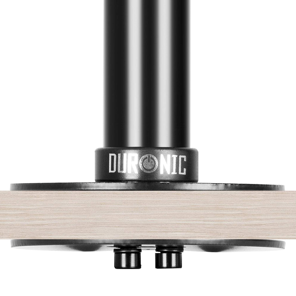 Duronic Grommet securely clamped to a light wood desk surface.