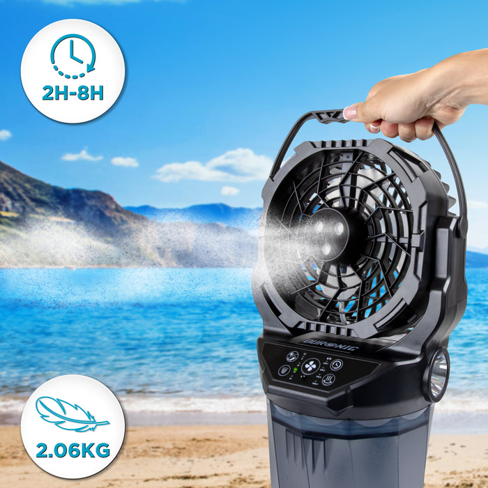 Duronic Handheld Misting Fan held by hand at a beach, showing lightweight and timer features.