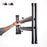 Duronic Keyboard Stand with a person easily lifts a lightweight, folded black metal keyboard stand with one hand.