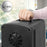 Duronic Mini Fridge Warmer using the integrated top carrying handle feature.