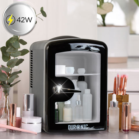 Duronic Mini Fridge Warmer with glass door filled with beauty products on vanity.