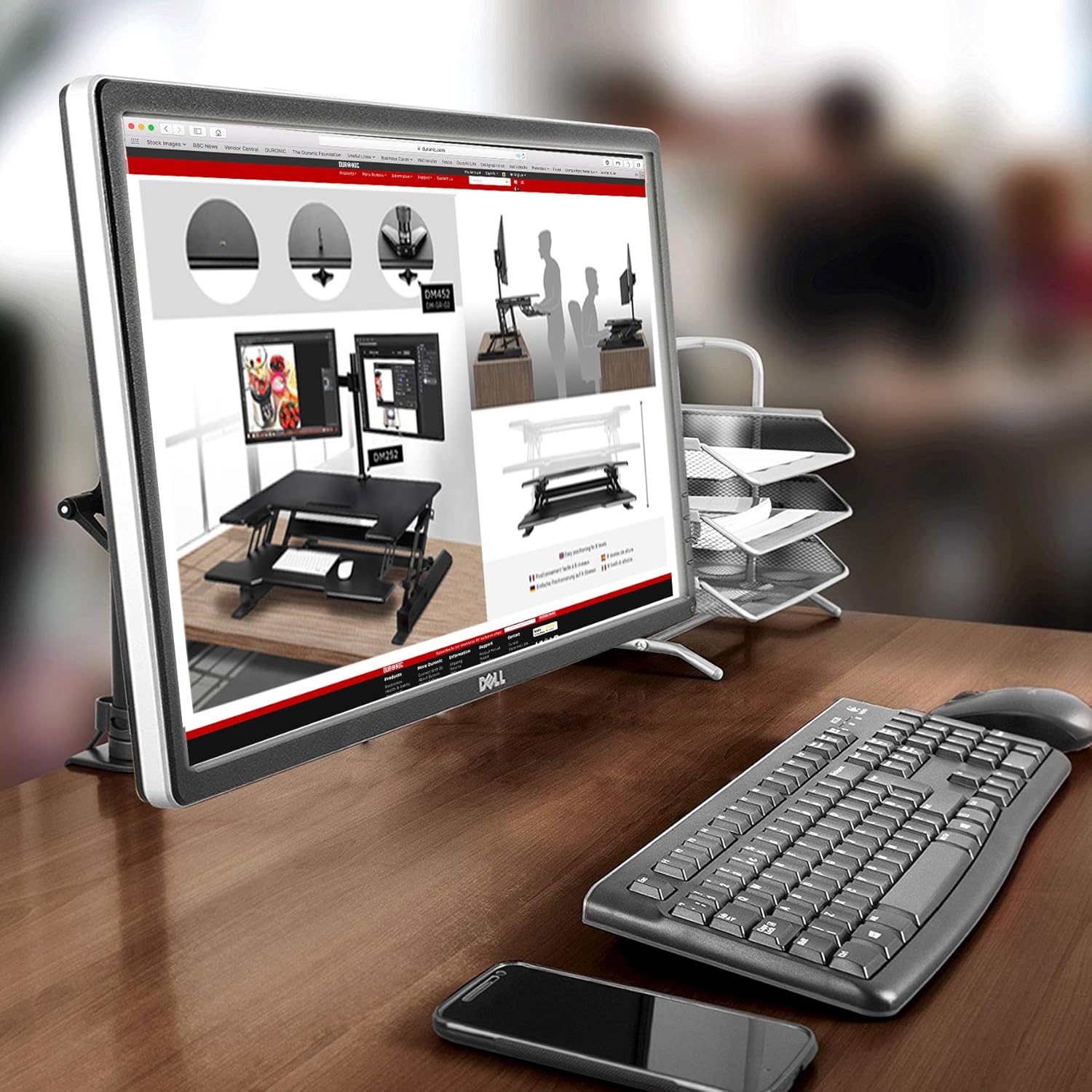 Duronic Monitor Arm Single on a wooden office desk with a keyboard.
