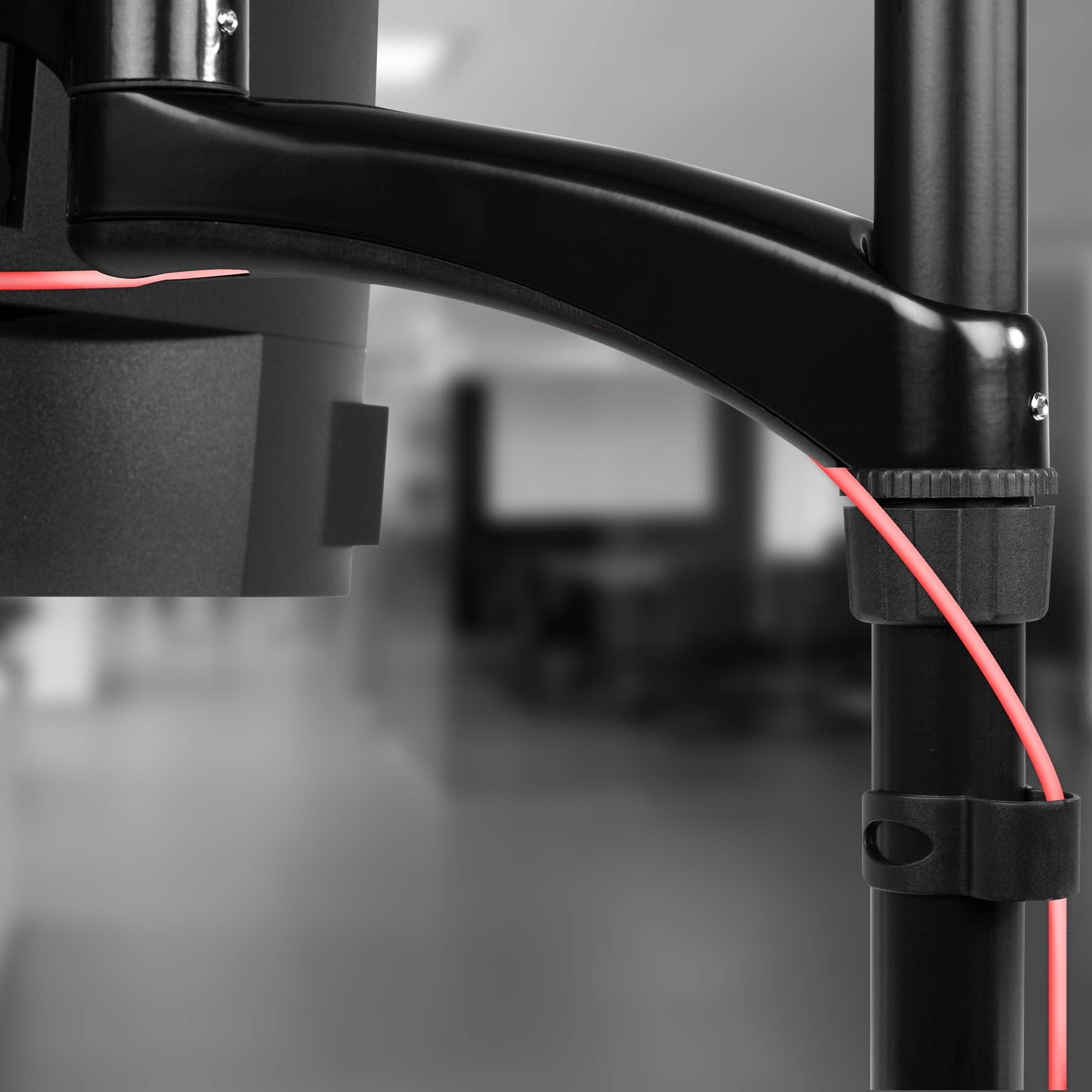 Duronic Monitor Arm Stand showcasing integrated cable management clips with a bright red cable.