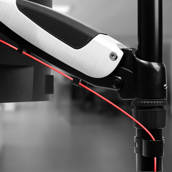 Duronic Monitor Arm Stand with red cable management wire attached to a black vertical pole.