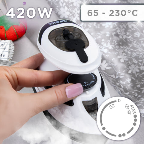 Duronic Travel Iron with hand adjusts the temperature dial on a compact 420W Duronic travel steam iron featuring a 65-230°C range and a white ergonomic design.
