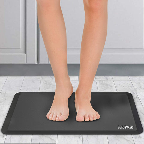 Duronic Anti-Fatigue Mat with a person stands on an anti-fatigue mat.