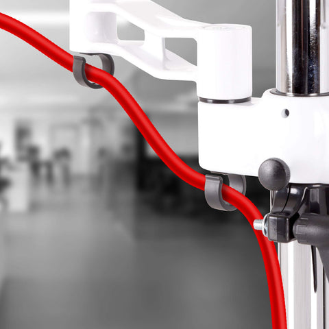 Duronic Dual Monitor Stand with grey cable management clips holding a bright red power cord.