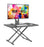 Duronic Sit-Stand Desk with a monitor, keyboard, and mouse on a black desktop.