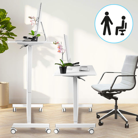 Duronic Sit Stand Desk Top shown in both elevated and lowered positions with office chair.