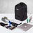 Duronic Laptop Backpack surrounded by neatly laid-out travel items, a laptop, shoes, and toiletries.