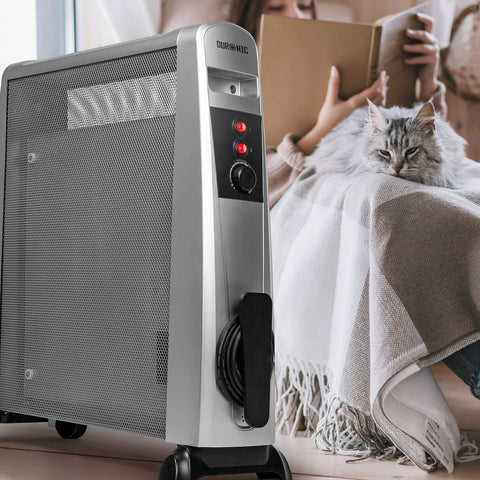 Duronic Electric Heaters in silver, warming a cozy room with a cat nearby.