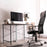 Duronic Cable Management Spine featuring a white modular cable management spine organized neatly under a wood-topped desk with a black mesh chair.