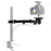 Duronic Camera Arm with articulated arm and C-clamp holding a professional DSLR camera.