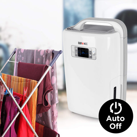 Duronic Dehumidifier with a digital display and auto-off feature stands next to a drying rack of clothes to demonstrate its laundry-drying capabilities.