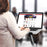 Duronic Desk Mount with woman using a laptop mounted on an ergonomic stand while browsing an online shopify store.