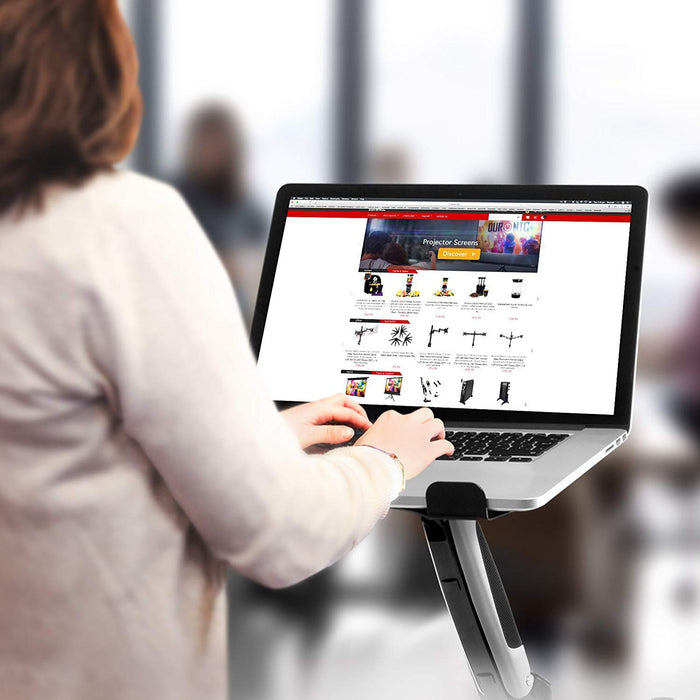 Duronic Desk Mount with woman using a laptop mounted on an ergonomic stand while browsing an online shopify store.