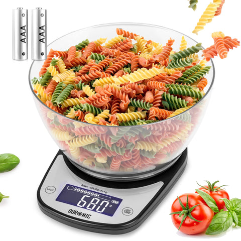 Duronic Digital Kitchen Scale featuring a large clear bowl filled with tri-color fusilli pasta, a backlit LCD display showing 680g, and two included AAA batteries.