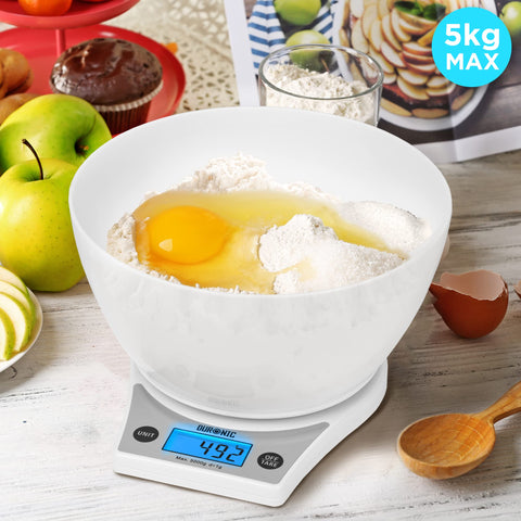 Duronic Digital Kitchen Scale with large bowl weighing flour and an egg, 5kg capacity.