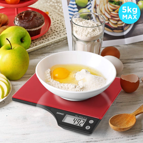 Duronic Digital Kitchen Scales weighing a white bowl of flour and eggs on a wooden table.