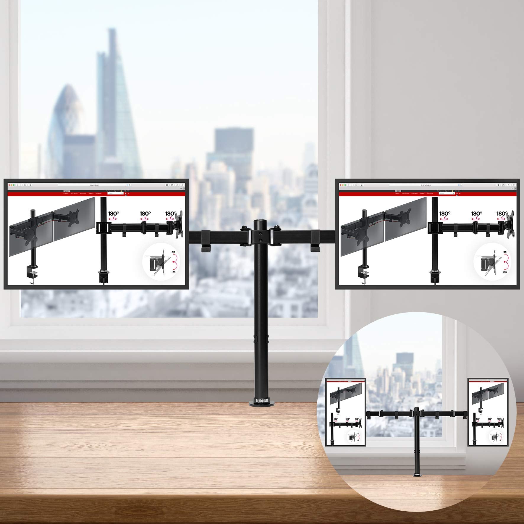 Duronic Dual Monitor Stand holding two screens side-by-side against a city window view.