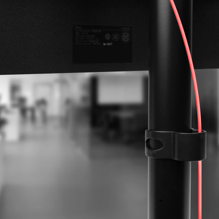 Duronic Dual Monitor Stand with a cable management clip holding a red wire.