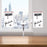 Duronic Dual Monitor Stand with adjustable articulating arms clamped to a wooden office table.