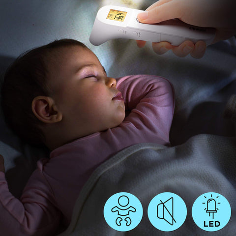 Duronic Ear and Forehead 3 in 1 Thermometer measuring the temperature of a sleeping baby in a dark room.