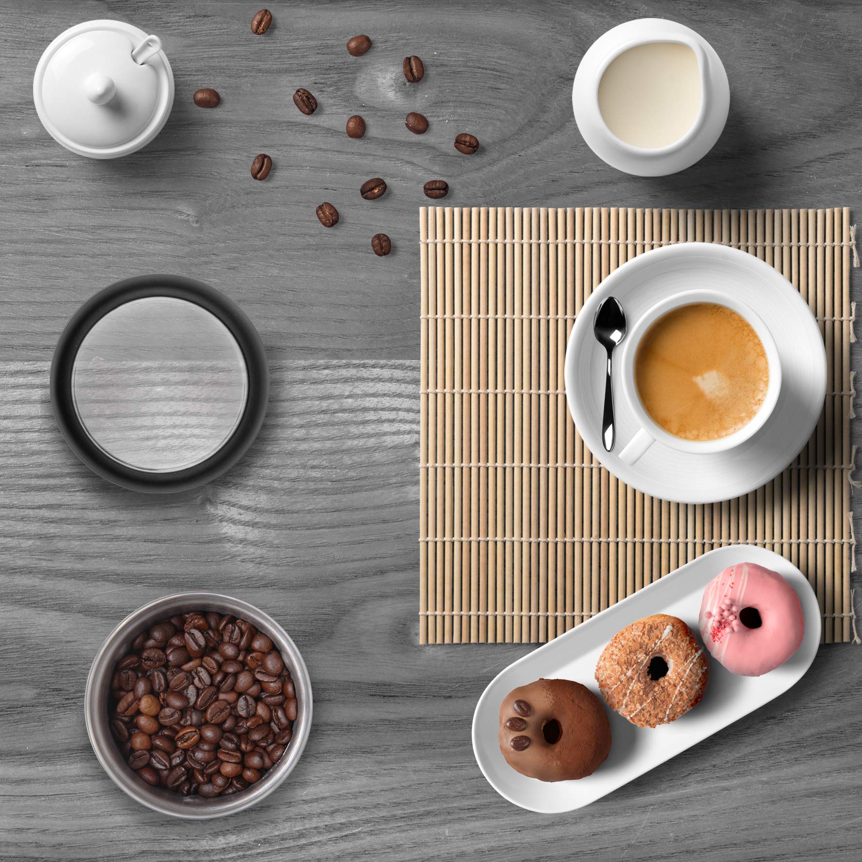 Duronic Electric Coffee Grinder with a cup, three donuts, loose coffee beans, and cream.