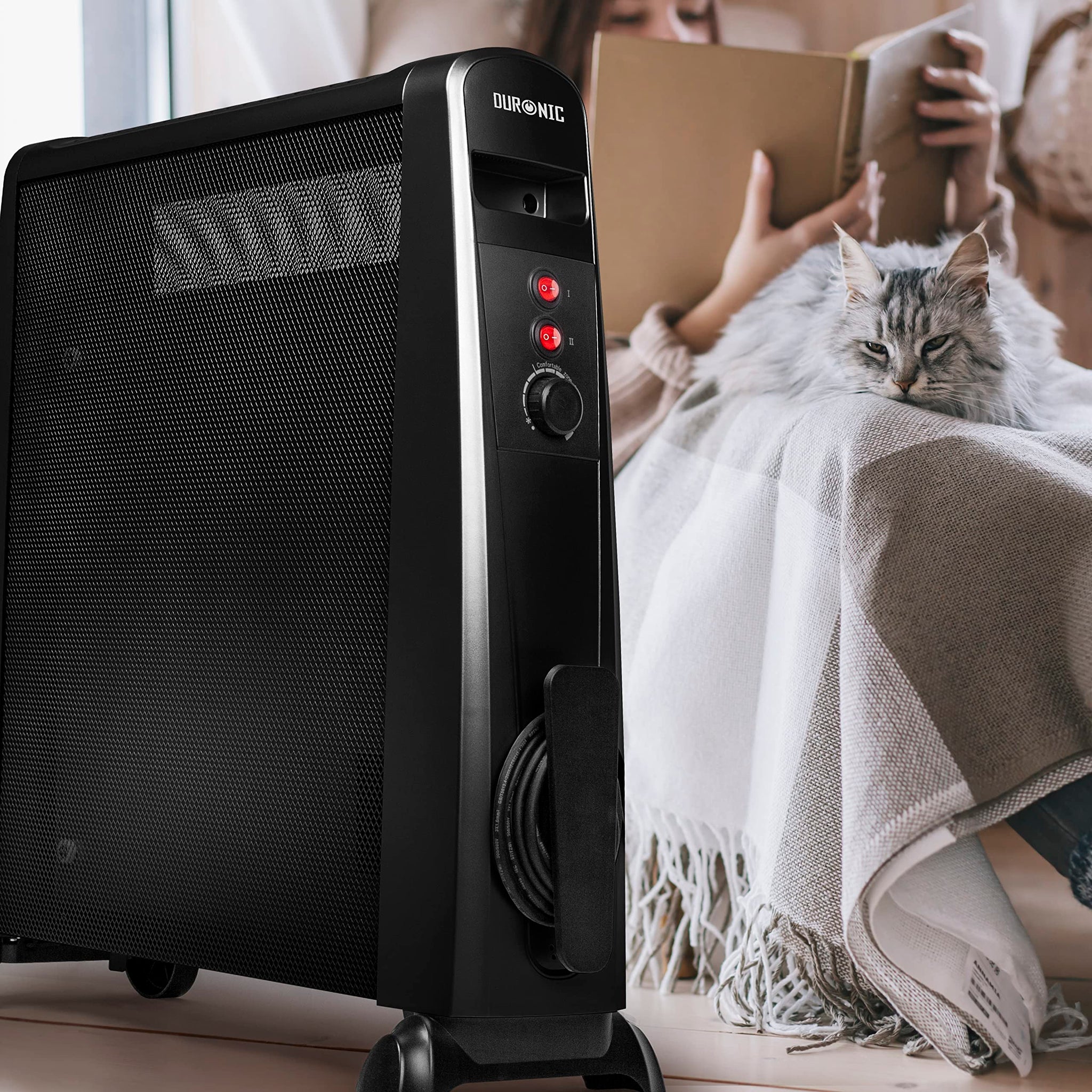 Duronic Electric Heaters on wheels next to a woman reading with her cat.