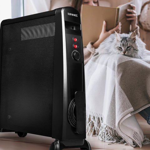 Duronic Electric Heaters on wheels next to a woman reading with her cat.