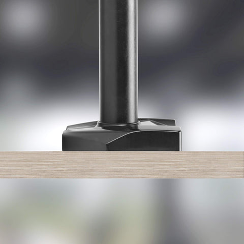 Duronic Grommet 3 clamped securely onto a light wood grain desk surface against blurred background.