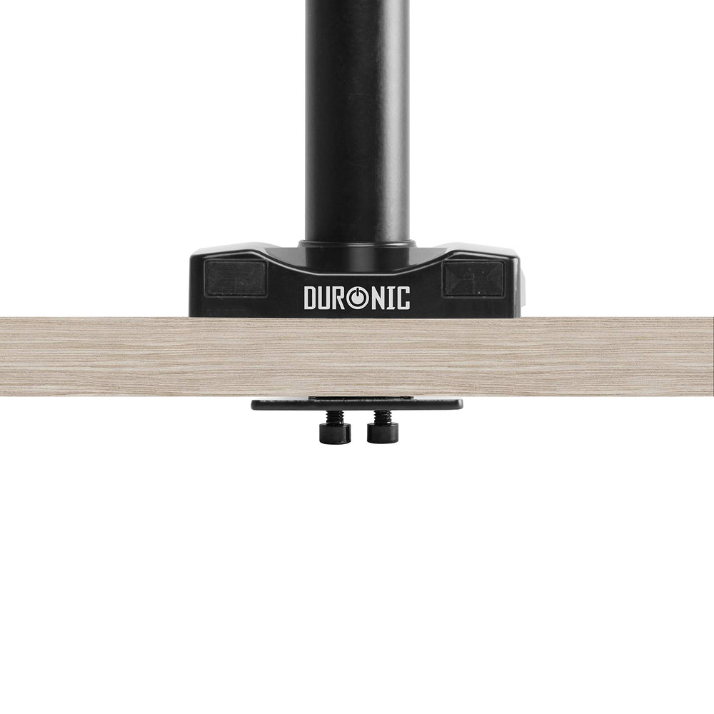 Duronic Grommet 3 with a black pole clamped securely to a light wood tabletop.