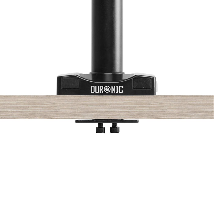 Duronic Grommet 3 with a black pole clamped securely to a light wood tabletop.