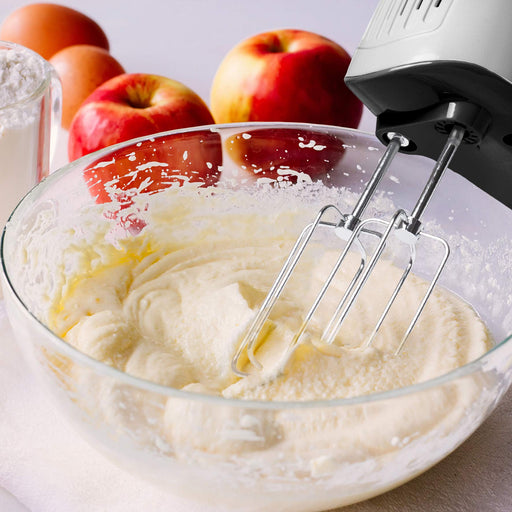 Duronic HM4 SR hand mixer electric whisk mixing ingredients together in a bowl with apples in background