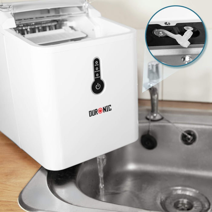 Duronic Ice Maker draining water into a kitchen sink with close-up of drain plug.