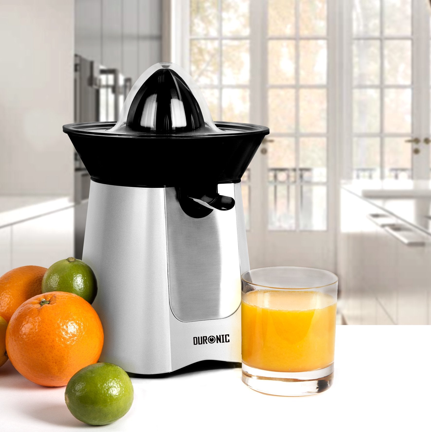 Duronic JE6SR electric citrus juicer aesthetically shown on kitchen countertop with orange juice