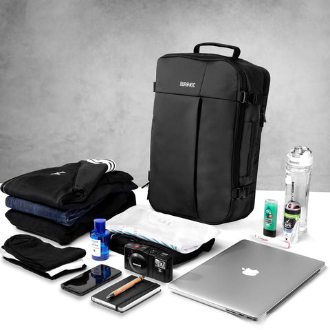 Duronic Laptop Backpack surrounded by packed essentials, including clothes, a laptop, and toiletries.